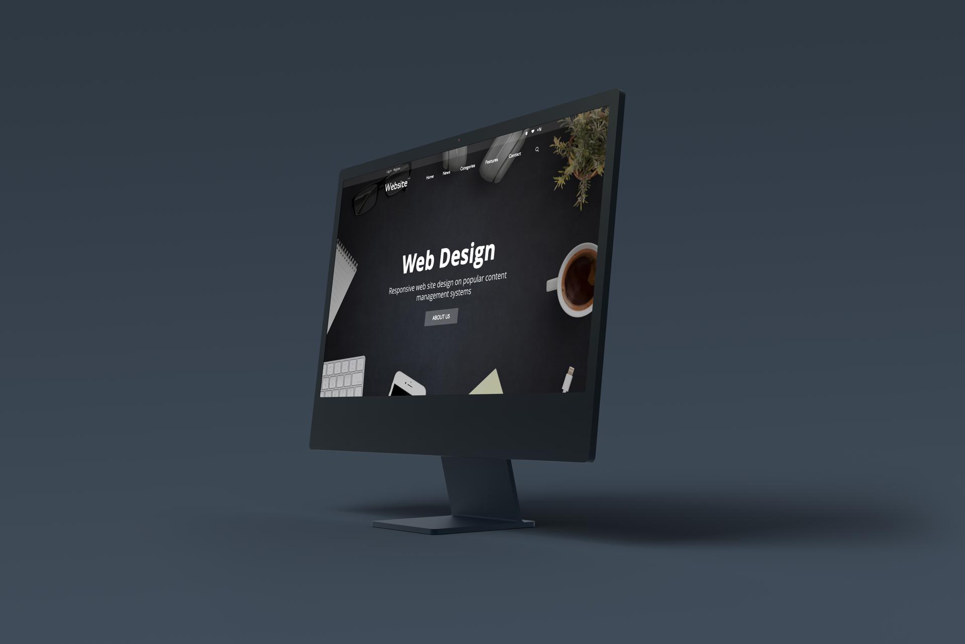 Black computer display with web design concept page layout. Web design and development studio presentation