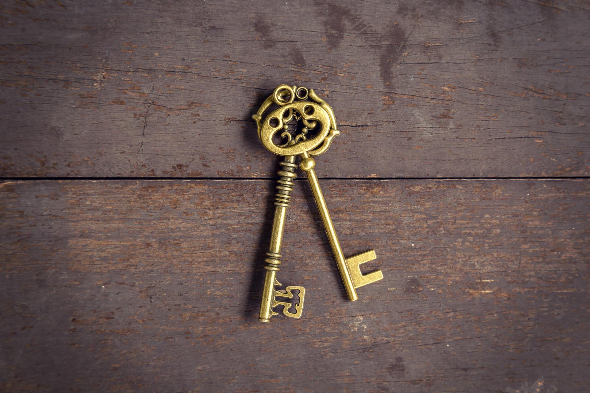 Old key vintage on wood background and texture with space.