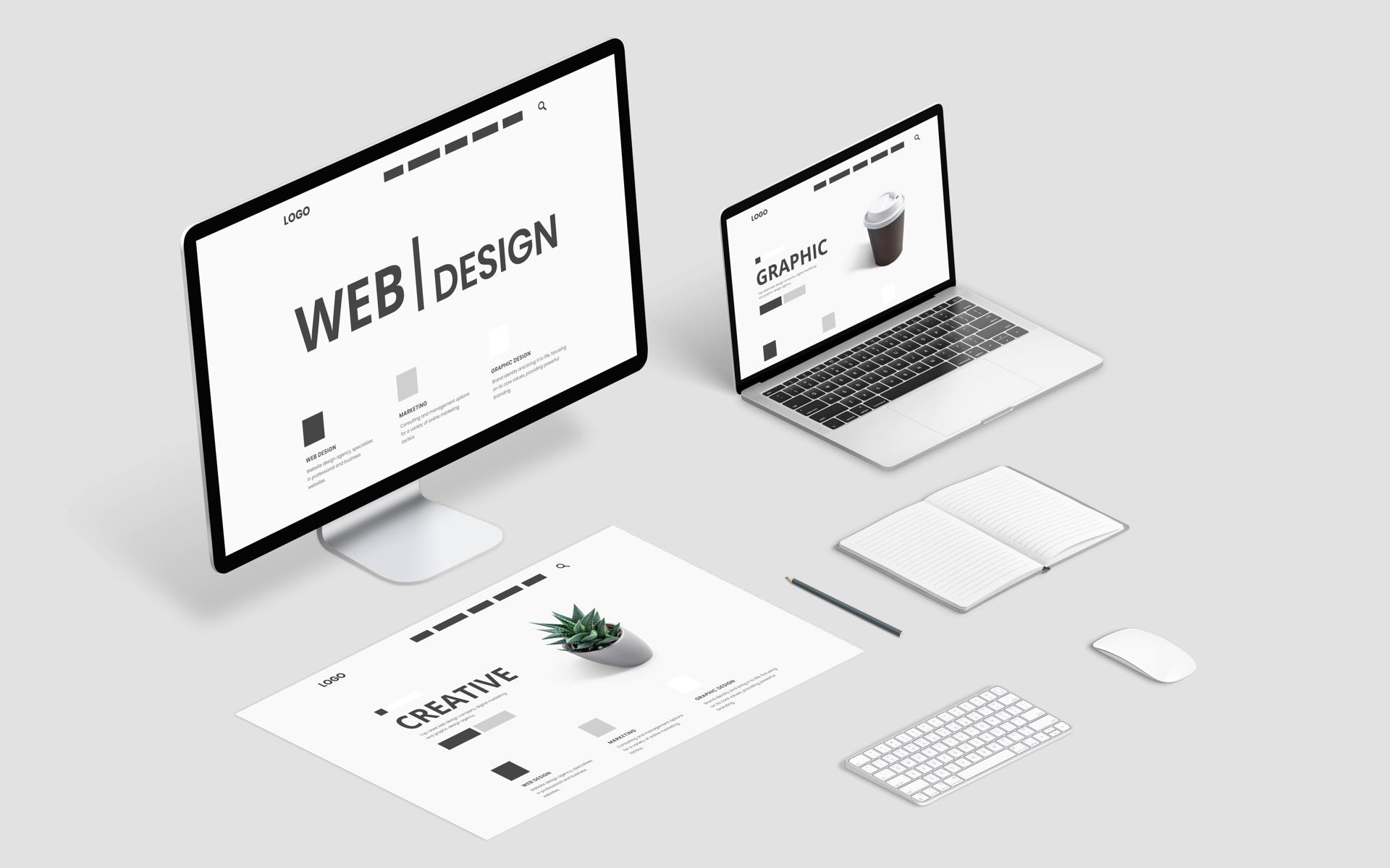 Isometric web design studio desk with computer display, laptop and concept page layout